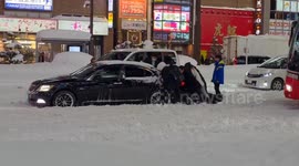 Japan: Record Snowfall Leaves Cars Stuck in Downtown Sapporo