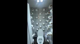 Bathroom at this cafe has hundreds of toilet rolls on the walls