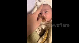 China: Chinese mom shows ‘one-swipe shutdown’ trick to make baby fall asleep instantly