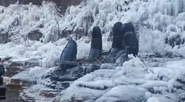 China: Chinese monkeys enjoy warm hot spring while snow surrounds them
