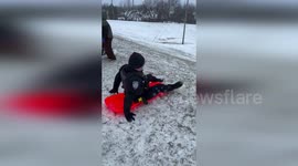 US: Jenks Police Join Snow Day Sledding Fun