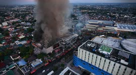 Fire trucks tackle blaze engulfing mall in the Philippines