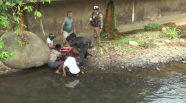 Brave fisherman saves girl after she fell from a bridge into a canal