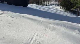 Fun sledding down snowy driveway in Ferndale, Arkansas, USA