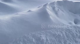 Peaceful sunrise reveals snow-covered coast after nor’easter in Ogunquit, Maine, USA