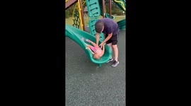 Daughter Falls Backward Off Slide Wall