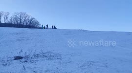 Sledding Man Slides Into Pole