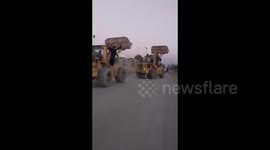 Syria: Drivers of heavy machinery are celebrating the completion of the temporary rehabilitation works on the Al-Asharah bridge, which connects the two banks of the Euphrates