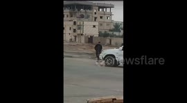 Syria: Elements from the Ministry of Interior forces are assisting sanitation workers in cleaning the site where the flag of the Syrian Arab Republic was raised at the Flag Roundabout in the Tabaqah city