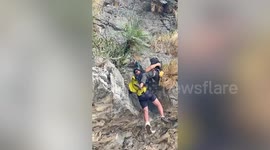 Hapless British tourist, 51, rescued from cliff in botched paragliding flight