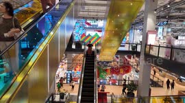 Colourful escalators and walkways are a hit at this shopping mall