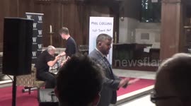 Newsflare Edit - Phil Collins appears to struggle to get out of chair at Q&A in London