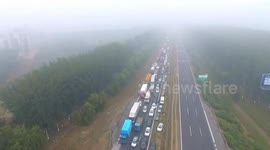 Extreme smog brings traffic to a standstill in Beijing