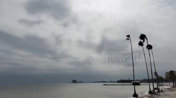 Dark storm clouds and gusty winds move across at Tampa Bay in St ...