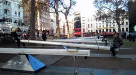 A Sea Of Singing See-Saws in Leicester Square Garden