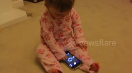Clever 1 yr Old Knows How To Swipe On Phone