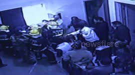 Two workers on tricycle break through elevator door and fall down shaft