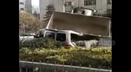 Residence management sends bulldozer to crush apartment owner's minibus