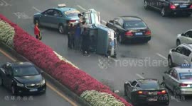 Taxi knocked over by sports car while changing lane