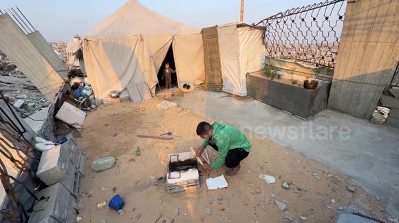 Palestinian family holds iftar on ruins of destroyed home in Gaza - Buy ...