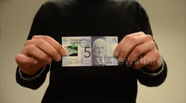 New five pound note erased with rubber