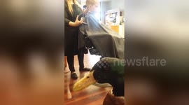 Newsflare Edit - Getting a haircut is easier when your best friend is with you