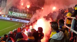 Football fans throw flares at each other in Poland