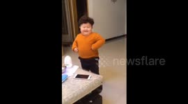 Chubby boy dances to music in China