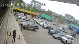 Reversing car flips over in carpark