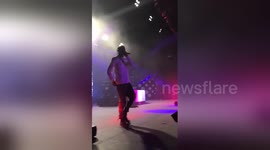Travis Scott invites fan onto stage