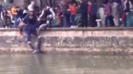 People form human ladder to rescue an elderly man who fell into river