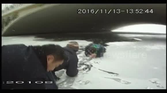 Good samaritans and police officer rescue boy who fell into icy lake ...