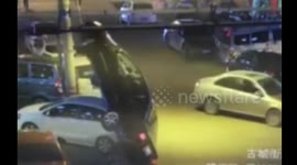 Car flips over after driving on the wire of a telegraph pole