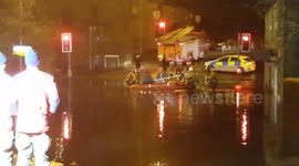 Firefighters rescue people from flood brought by Storm Angus in Manchester