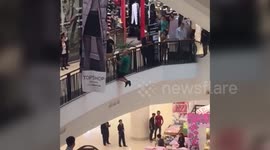 British tourist is talked down from shopping mall ledge