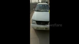 Man sticks hand-writing licence on car