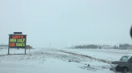 Car Gets Stuck in Snowstorm