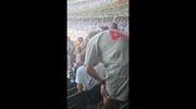 Bizarre moment captured when Cubs fan smacks young man who stayed seated during national anthem in Chicago