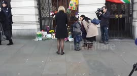 Children paying respect to Mandela at South Africa Embassy London 6th Dec