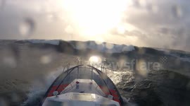 Boat braves huge waves after UK storm