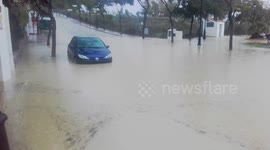 Car gets caught in major flooding in Costa Del Sol
