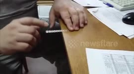 Man plays 'Imperial March' from 'Star Wars' with coffee stirrer