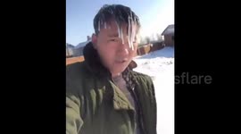 Man's hair freezes as northern China is hit by polar tempartures