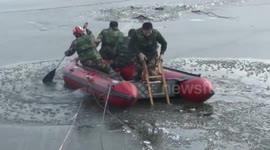 Two men rescued after falling into an icy lake in China