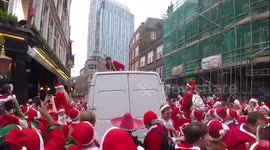 Santas on top of van