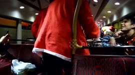 Santacon revellers perform bizarre game on bus