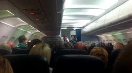 Captain of Thomas Cook flight talking to passengers about problem with in flight meals