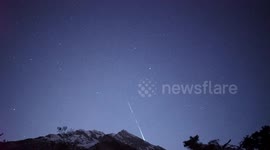 Geminid meteor next to airplane contrail