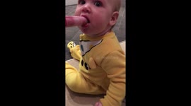 Baby really loves her ice lolly