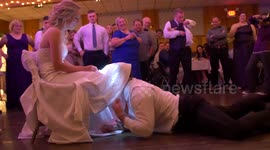 Groom looks for bride's garter with head torch